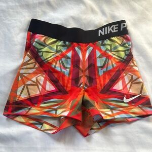 Nike Red and Orange Athletic Shorts with Geometric Design